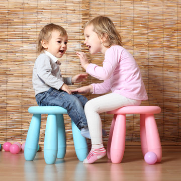 Little siblings talking together.