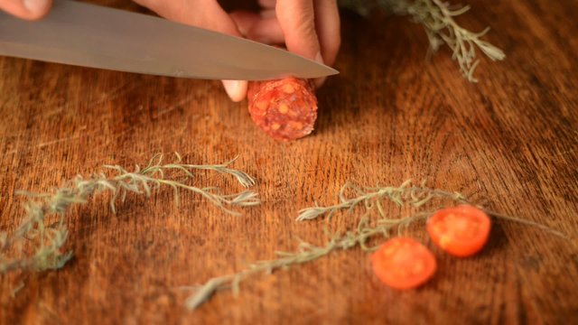 cutting a spicey salami in slices