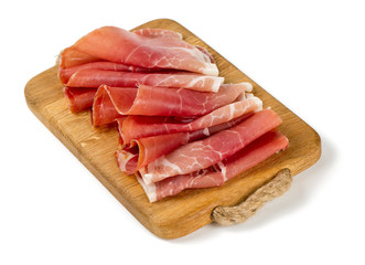 sliced prosciutto on a wooden board