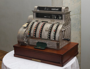 Vintage cash register on the table right view