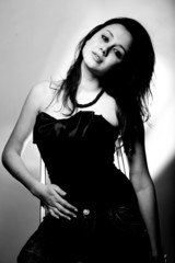 Fototapeta premium Black and white portrait of brunette woman in corset