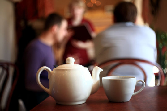 teapot and cup in a cafe