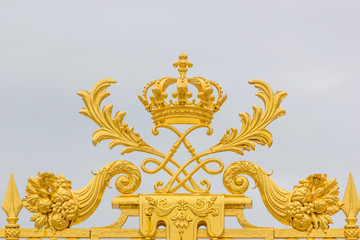 Golden ornate gate of Chateau de Versailles