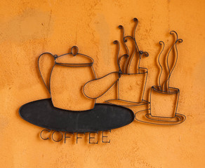 coffee cup and pot logo on orange texture background
