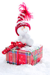 Snowman sitting on gift box