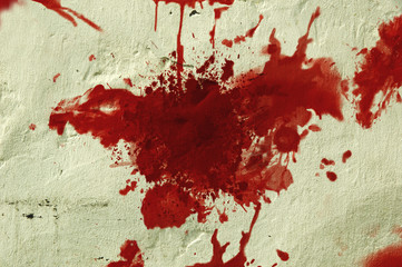 Red blood splatter on a wall.