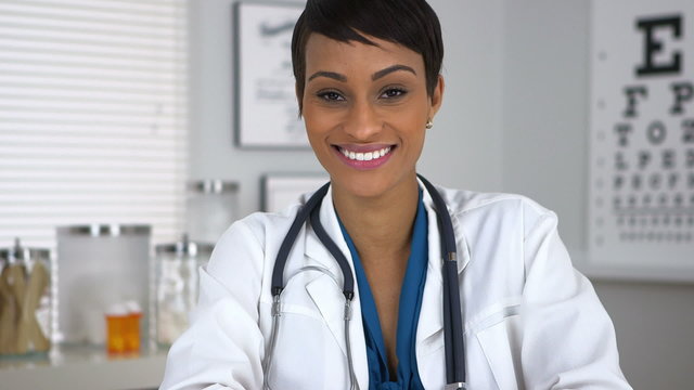 Doctor sitting at desk in office