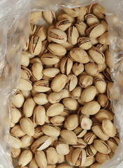 Closeup of pistachios in nut shells as food background