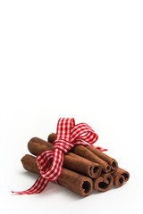 cinnamon sticks with christmas bow