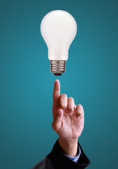 hands pointing at lamp, idea concept