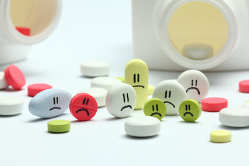 Pills with sad faces