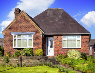 Fototapeta na wymiar Red brick house with garden