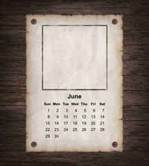 Calendar 2014, vintage paper on wood background
