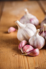 Raw garlic on wooden background