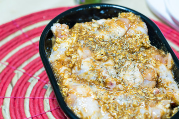Raw chicken drumstick marinated in herbs and spices for Barbecue