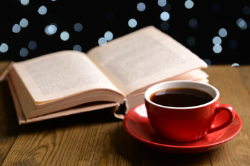 Composition of book with cup of coffee