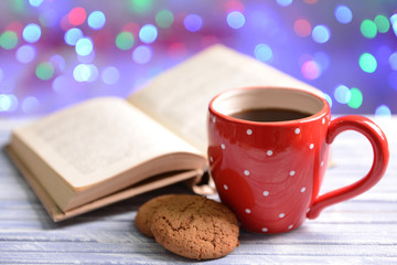 Composition of book with cup of coffee