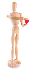 Wooden mannequin holding red heart isolated on white