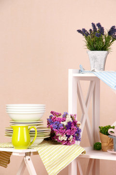 Beautiful white furniture with tableware and decor,