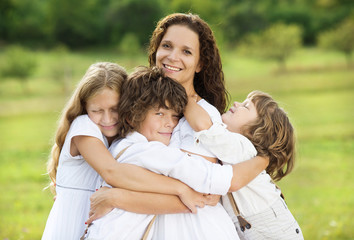 Fototapeta na wymiar Children and mother hugging