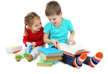 Fototapeta na wymiar Little children with books isolated on white