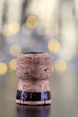Champagne cork on Christmas lights background