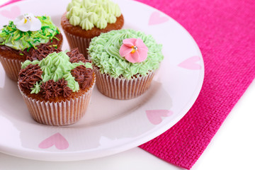 Tasty cupcakes with butter cream,