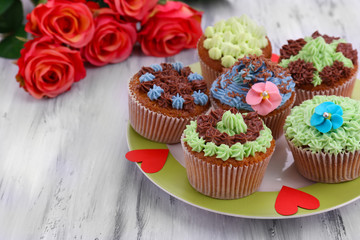 Tasty cupcakes with butter cream,