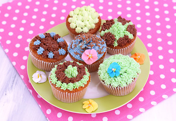 Tasty cupcakes with butter cream,