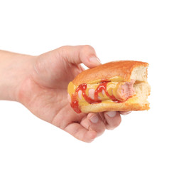 Hotdog with ketchup in hand.