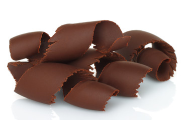 Chocolate shavings on white background .