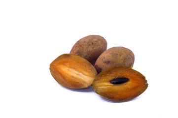 Sapodilla or chiku fruits over white background