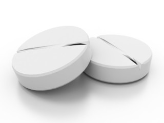 Two white medical pills on white background