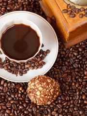 cup of coffee and roasted beans