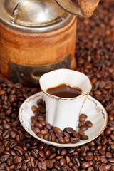 cup of coffee and roasted beans