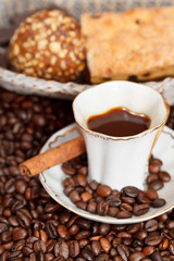 cup of coffee and roasted beans