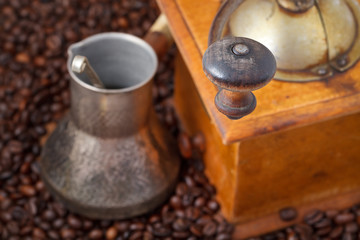 retro manual coffee mill on roasted beans