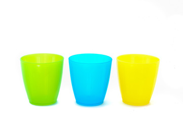 Plastic cups of various color isolated on white