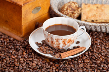 cup of coffee and roasted beans