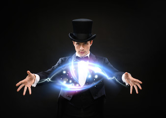 magician in top hat showing trick