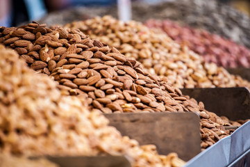 Obraz premium Assortment of nuts and almonds on market stand in Israel