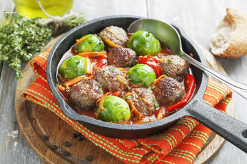 Meatballs with vegetables in tomato sauce