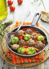 Meatballs with vegetables in tomato sauce