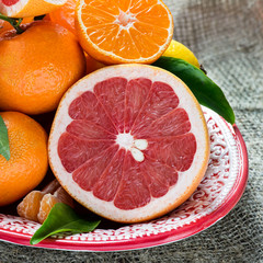 Fresh citrus fruits on rustic background
