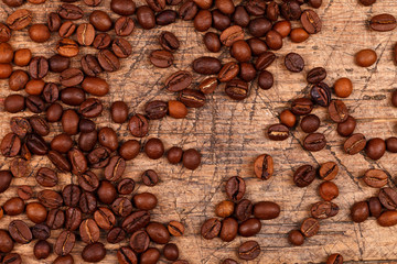 Coffe beans on old scratched table