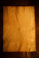 Empty parchment on wooden table