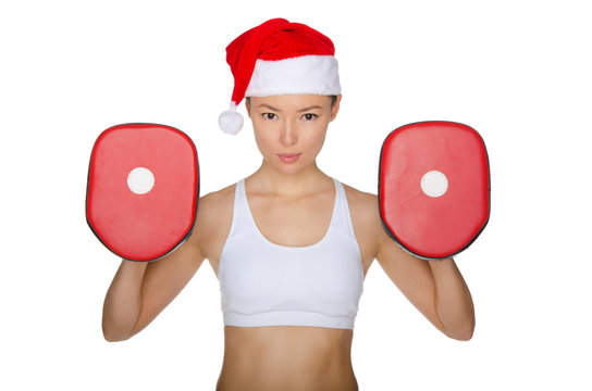 Woman protects herself in Santa Claus hat
