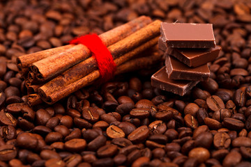 Obraz na płótnie Canvas Cinnamon sticks with chocolate on coffee