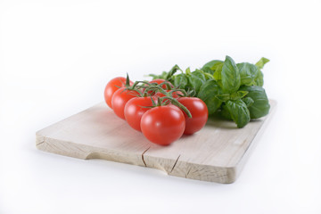 A board with tomato and basil