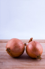 onions on chopping board on white background